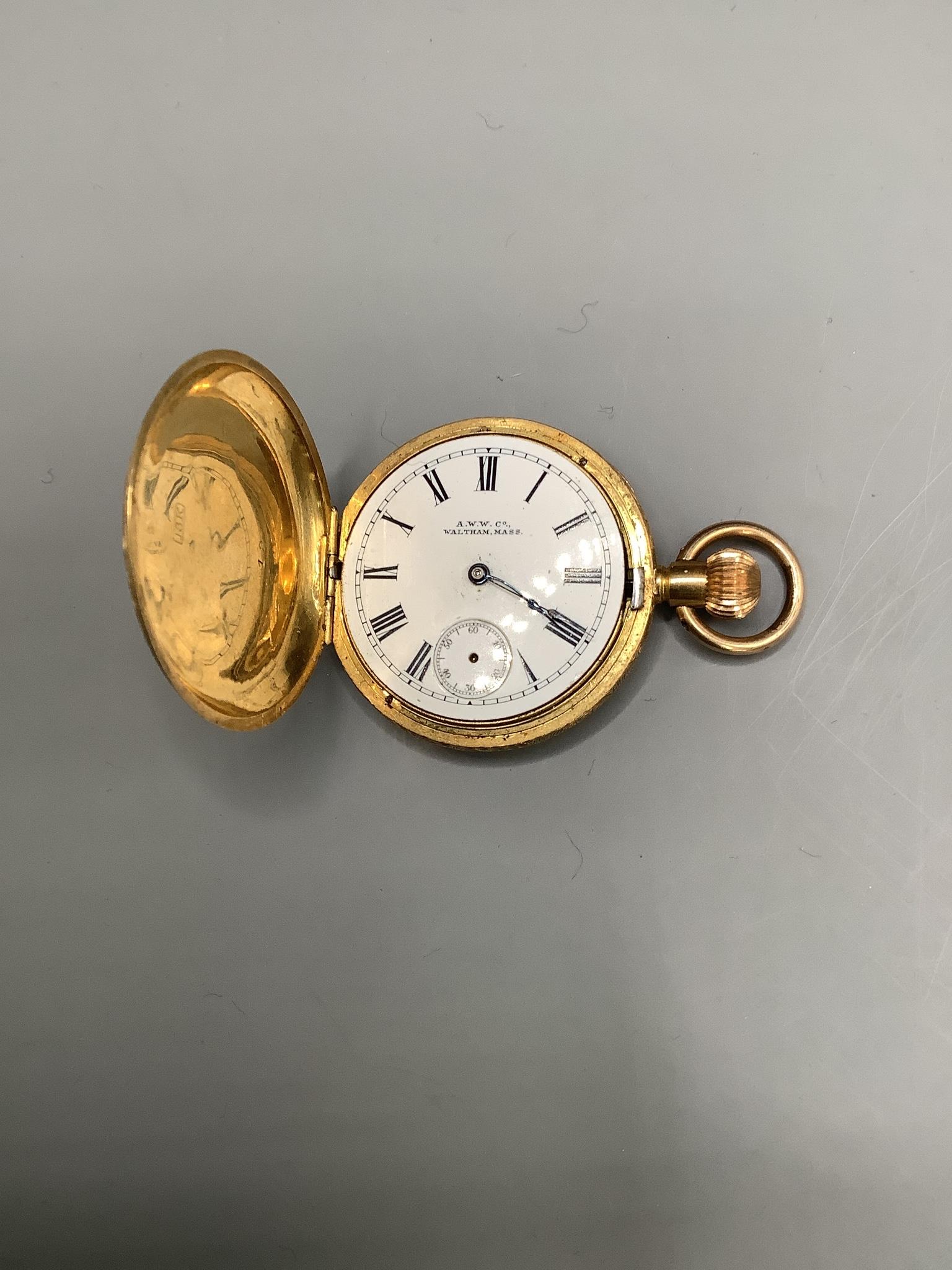An early 20th century engraved 18k Waltham hunter fob watch, case diameter 34mm, gross weight, 34.9 grams.